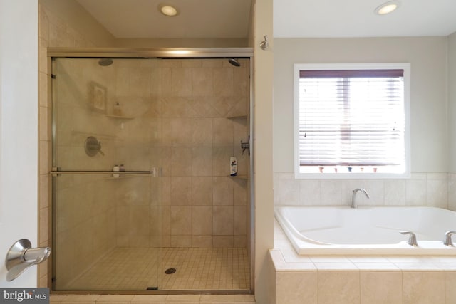 full bath with a garden tub, recessed lighting, and a stall shower