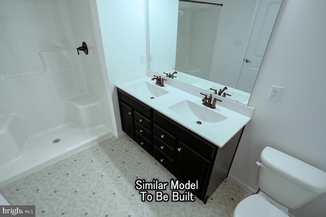 bathroom with vanity, walk in shower, and toilet