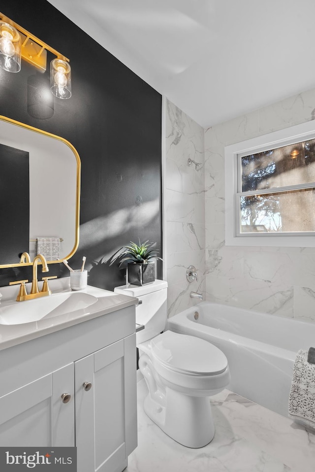 full bathroom with tiled shower / bath, vanity, and toilet