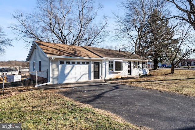 ranch-style home featuring a garage