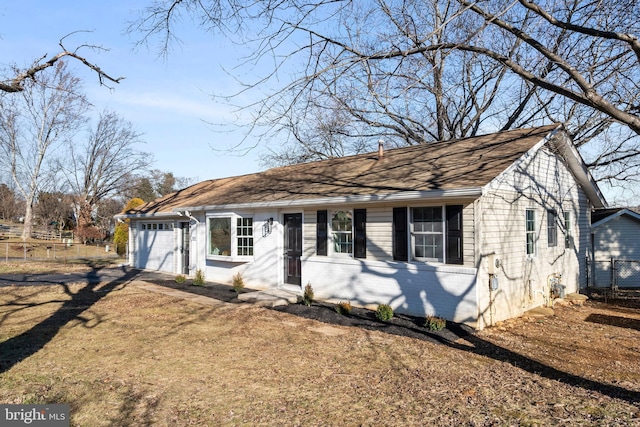 ranch-style home with a garage