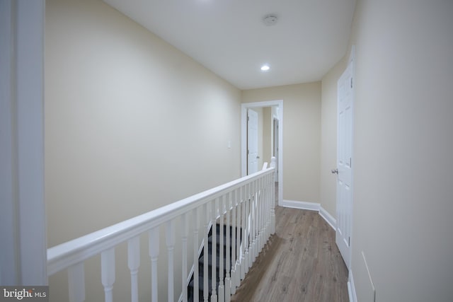 hallway with light hardwood / wood-style flooring