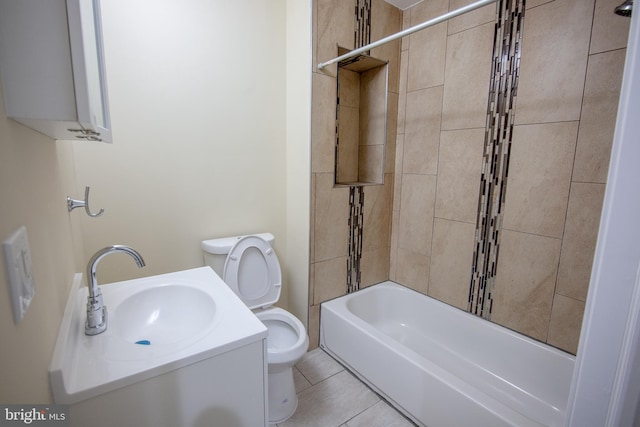 full bathroom with tiled shower / bath combo, vanity, tile patterned floors, and toilet