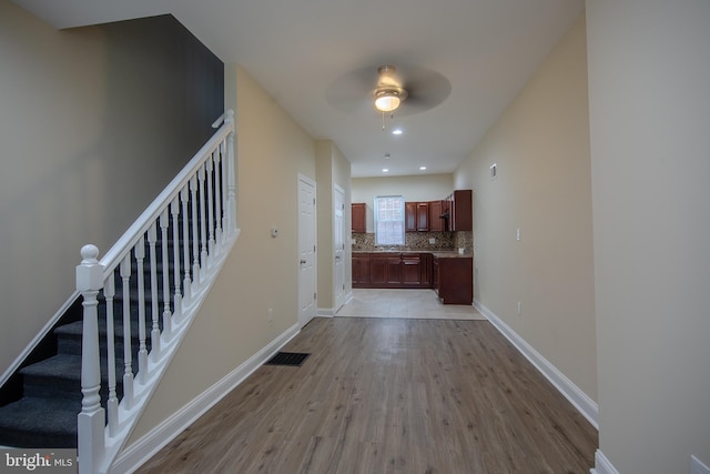 corridor featuring light hardwood / wood-style flooring