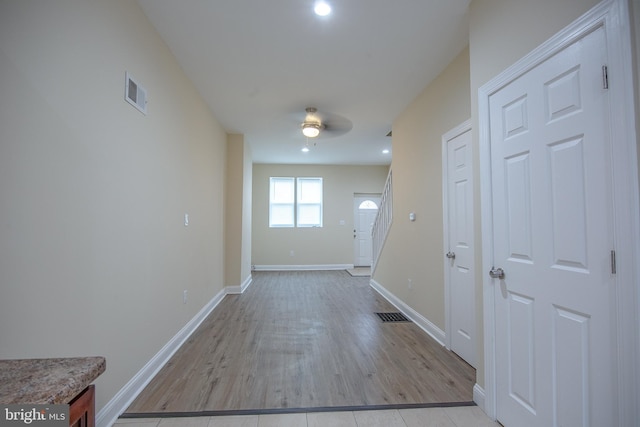 corridor featuring light wood-type flooring