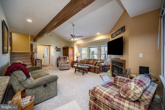 living room featuring light carpet, vaulted ceiling with beams, a textured ceiling, and ceiling fan