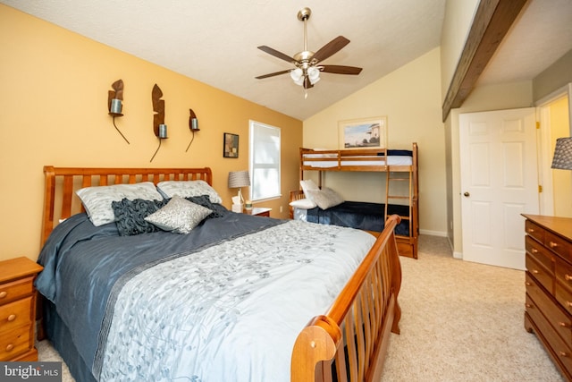 bedroom featuring vaulted ceiling, light colored carpet, and ceiling fan