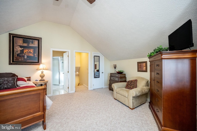 carpeted bedroom with ceiling fan, ensuite bath, lofted ceiling, and a textured ceiling