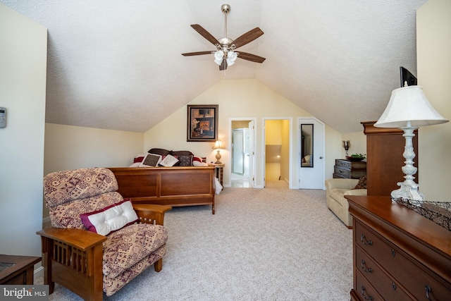 carpeted bedroom featuring ceiling fan, vaulted ceiling, and a textured ceiling