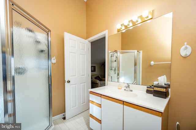 bathroom with tile patterned floors, an enclosed shower, and vanity