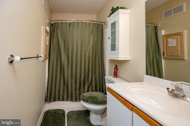 bathroom with toilet, a shower with curtain, a textured ceiling, vanity, and tile patterned flooring