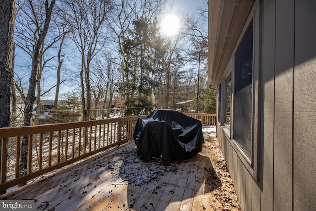 wooden terrace featuring grilling area