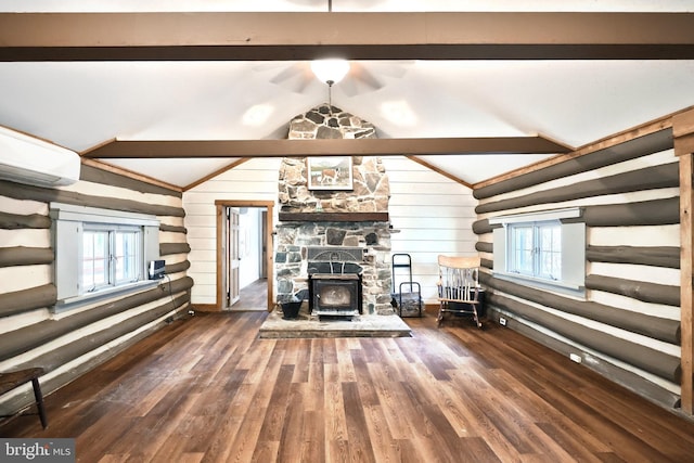 unfurnished living room featuring lofted ceiling, wooden walls, wood finished floors, and a wood stove