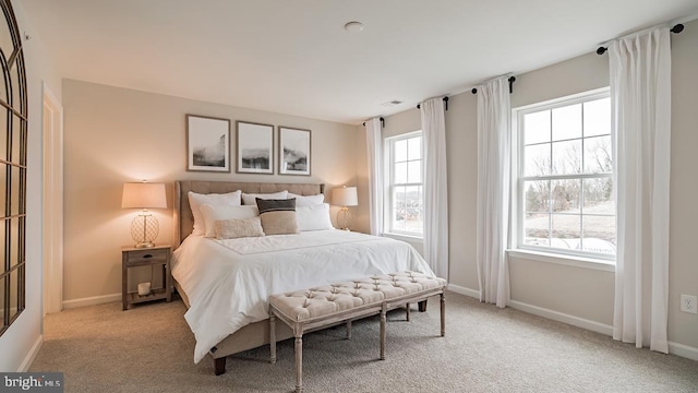 bedroom with light colored carpet