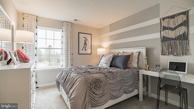 bedroom featuring light colored carpet