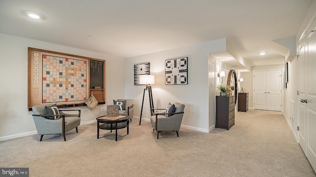 sitting room with light colored carpet