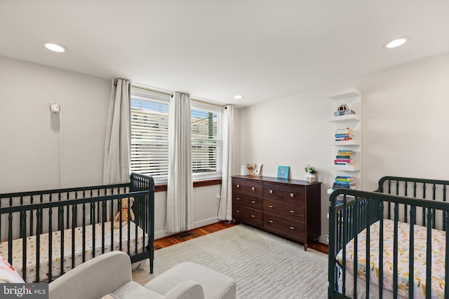 bedroom featuring light hardwood / wood-style floors