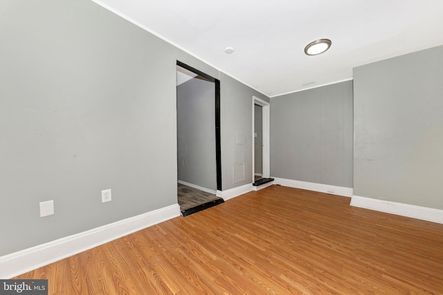 unfurnished room featuring wood-type flooring