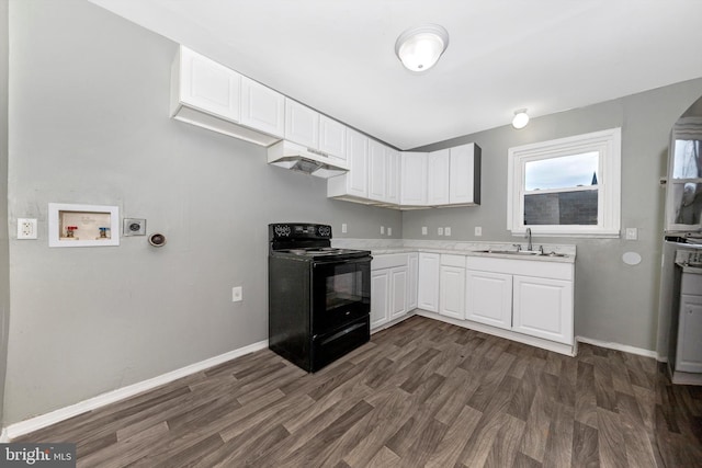 kitchen featuring sink, dark wood-type flooring, white cabinets, and black range with electric cooktop