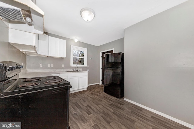 kitchen featuring sink, dark wood-type flooring, ventilation hood, black appliances, and white cabinets