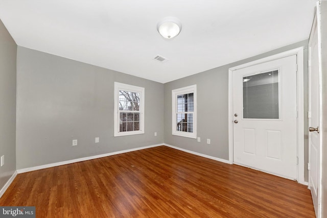 unfurnished room featuring hardwood / wood-style floors