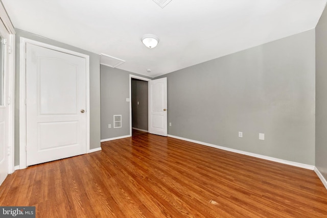 unfurnished bedroom with light wood-type flooring