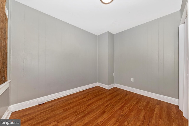 empty room with wood-type flooring