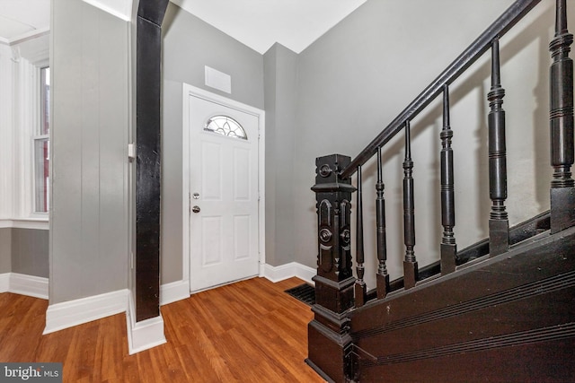 foyer entrance featuring a healthy amount of sunlight and hardwood / wood-style floors