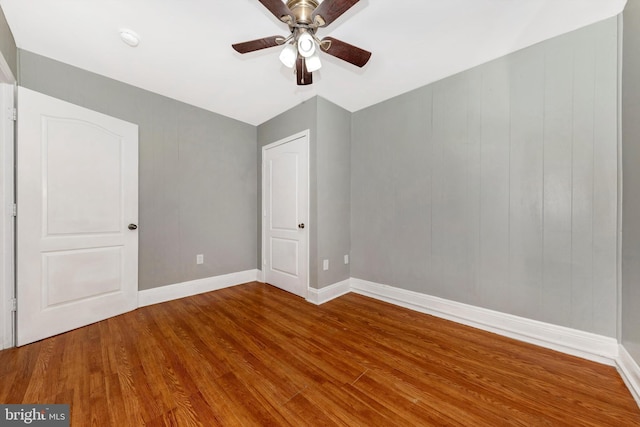 interior space with wood-type flooring and ceiling fan