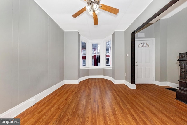 entryway with hardwood / wood-style flooring and ceiling fan