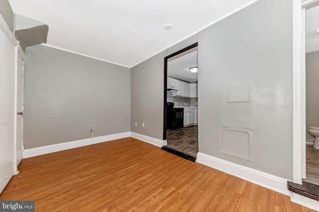 interior space with wood-type flooring and vaulted ceiling