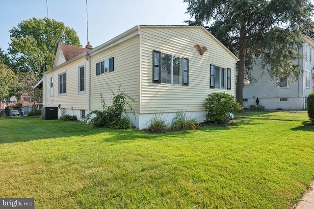 view of property exterior featuring cooling unit and a lawn