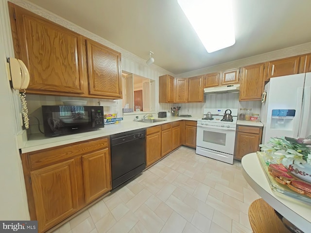 kitchen with sink and black appliances