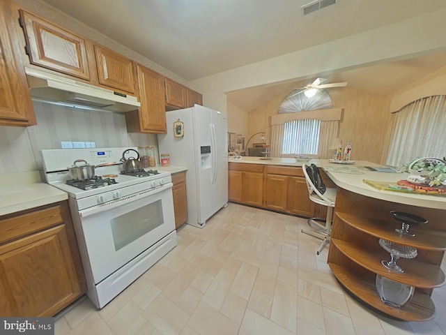 kitchen featuring tasteful backsplash, ceiling fan, and white appliances