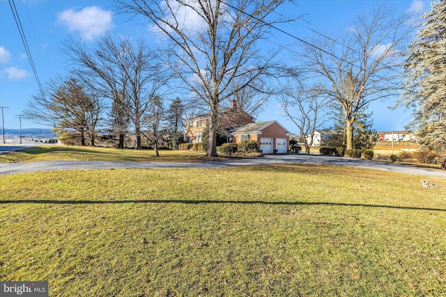 view of yard with a garage