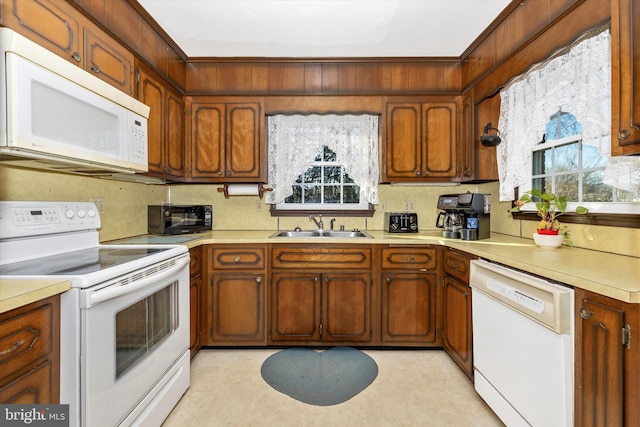 kitchen with sink and white appliances