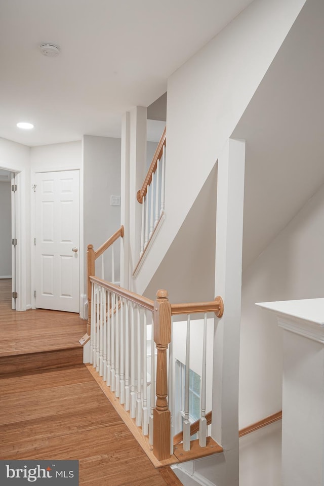 stairway featuring hardwood / wood-style floors