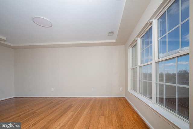 unfurnished room with light wood-type flooring