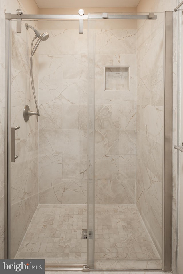 bathroom featuring an enclosed shower