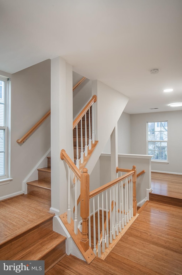 staircase featuring hardwood / wood-style flooring