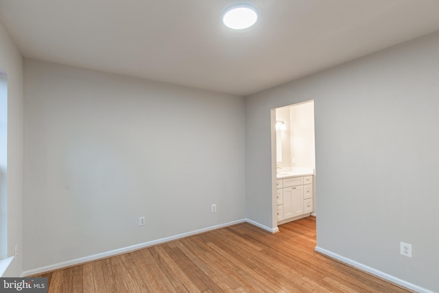 unfurnished room featuring light hardwood / wood-style flooring