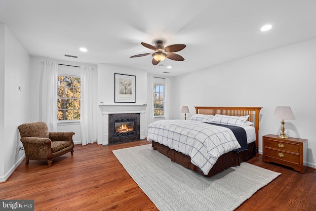 bedroom featuring ceiling fan and dark hardwood / wood-style flooring