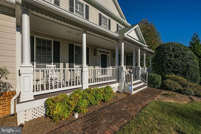 entrance to property with covered porch