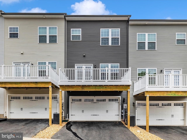 rear view of property with a garage