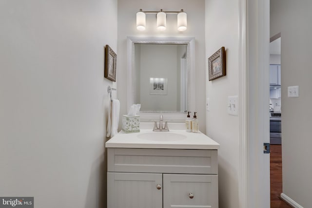 bathroom featuring hardwood / wood-style flooring and vanity