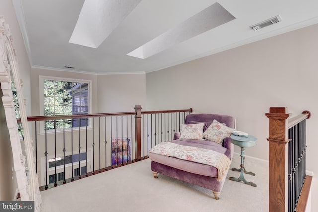 sitting room with ornamental molding, carpet floors, and a skylight