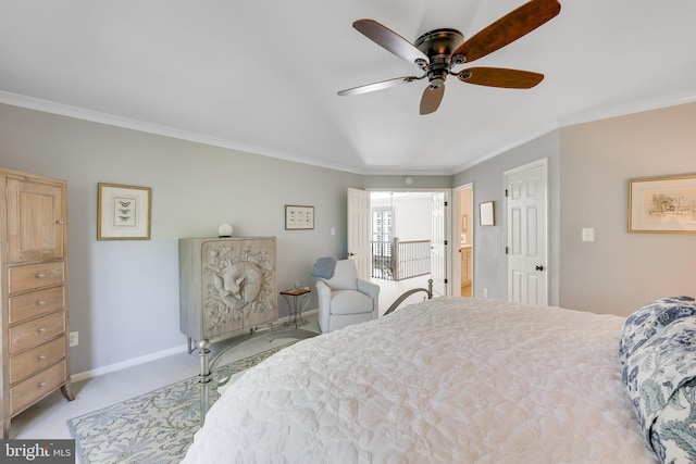 carpeted bedroom featuring crown molding and ceiling fan