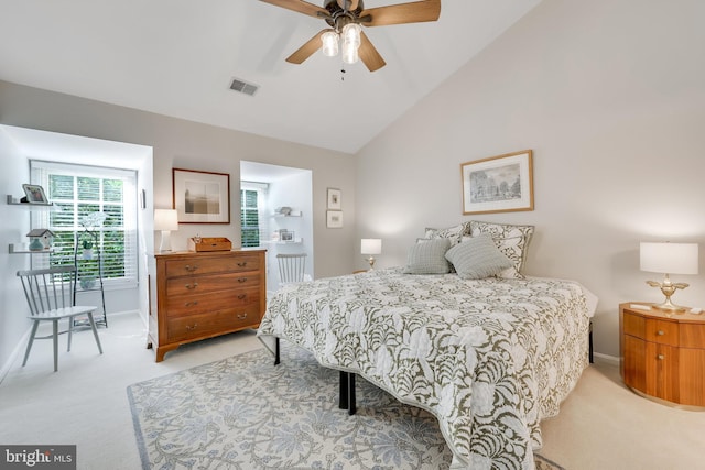 carpeted bedroom with lofted ceiling and ceiling fan