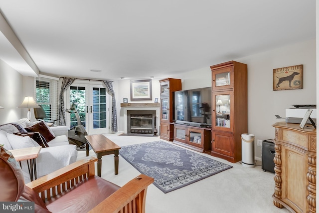 carpeted living room featuring french doors