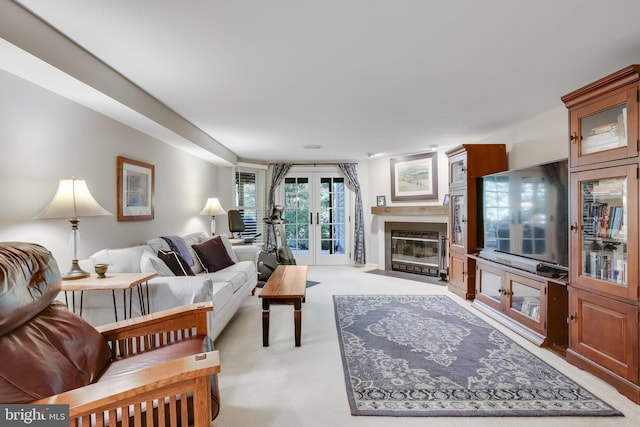 living room with french doors and light carpet